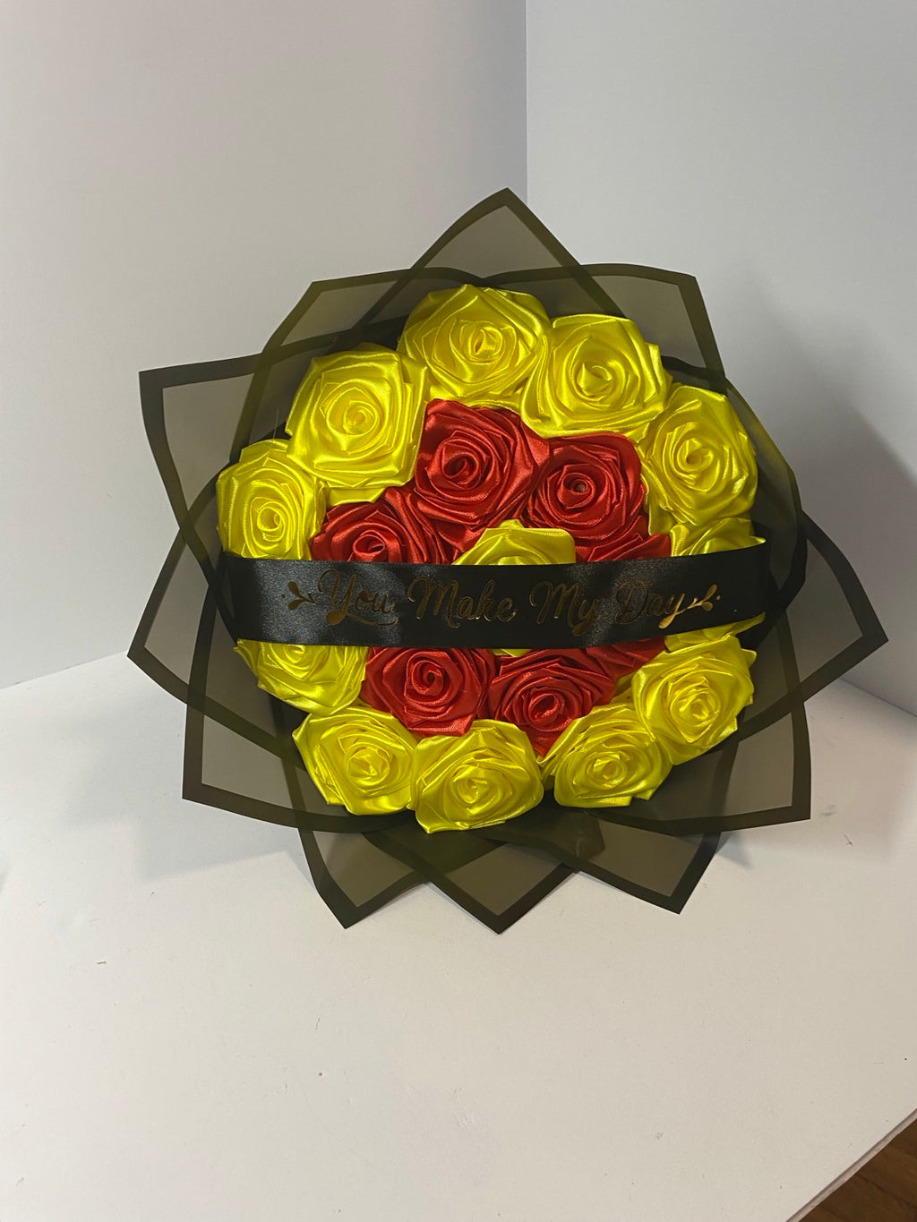 Red and yellow handmade satin rose bouquet with You Make My Day ribbon