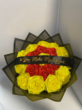 Back to School red and yellow satin rose bouquet with black wrap, top view