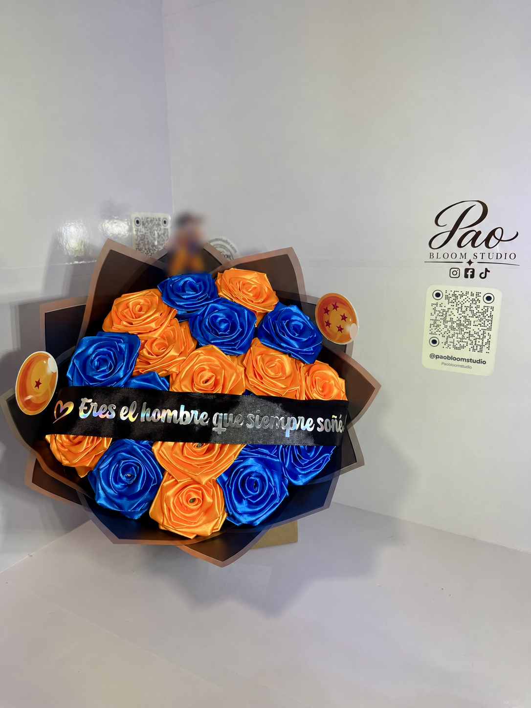 Blue and orange eternal satin rose bouquet front view