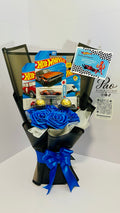 Blue racing gift bouquet with satin roses, toy cars and chocolates