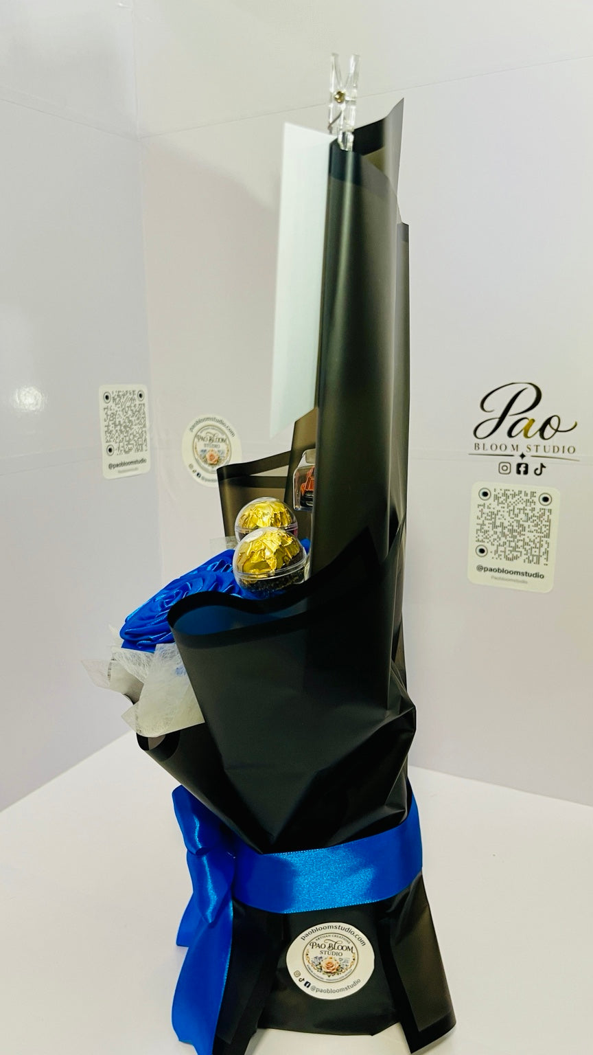 Side view of black and blue gift bouquet