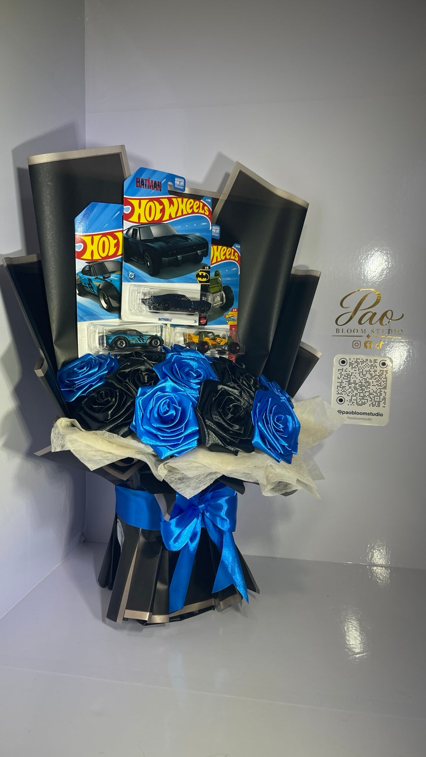 Front view of collectible car and satin rose bouquet