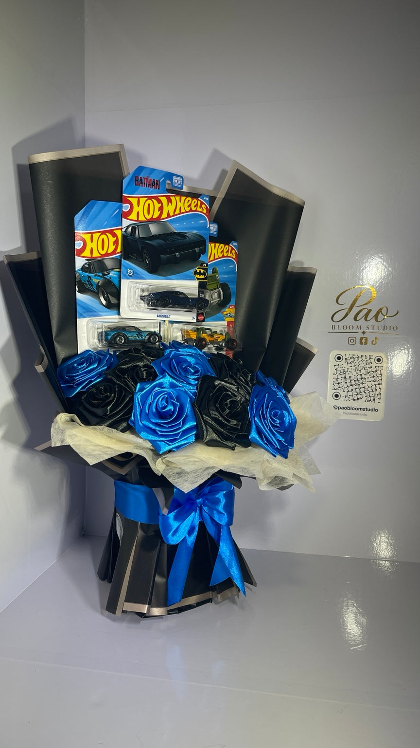 Full view of handmade blue and black gift bouquet