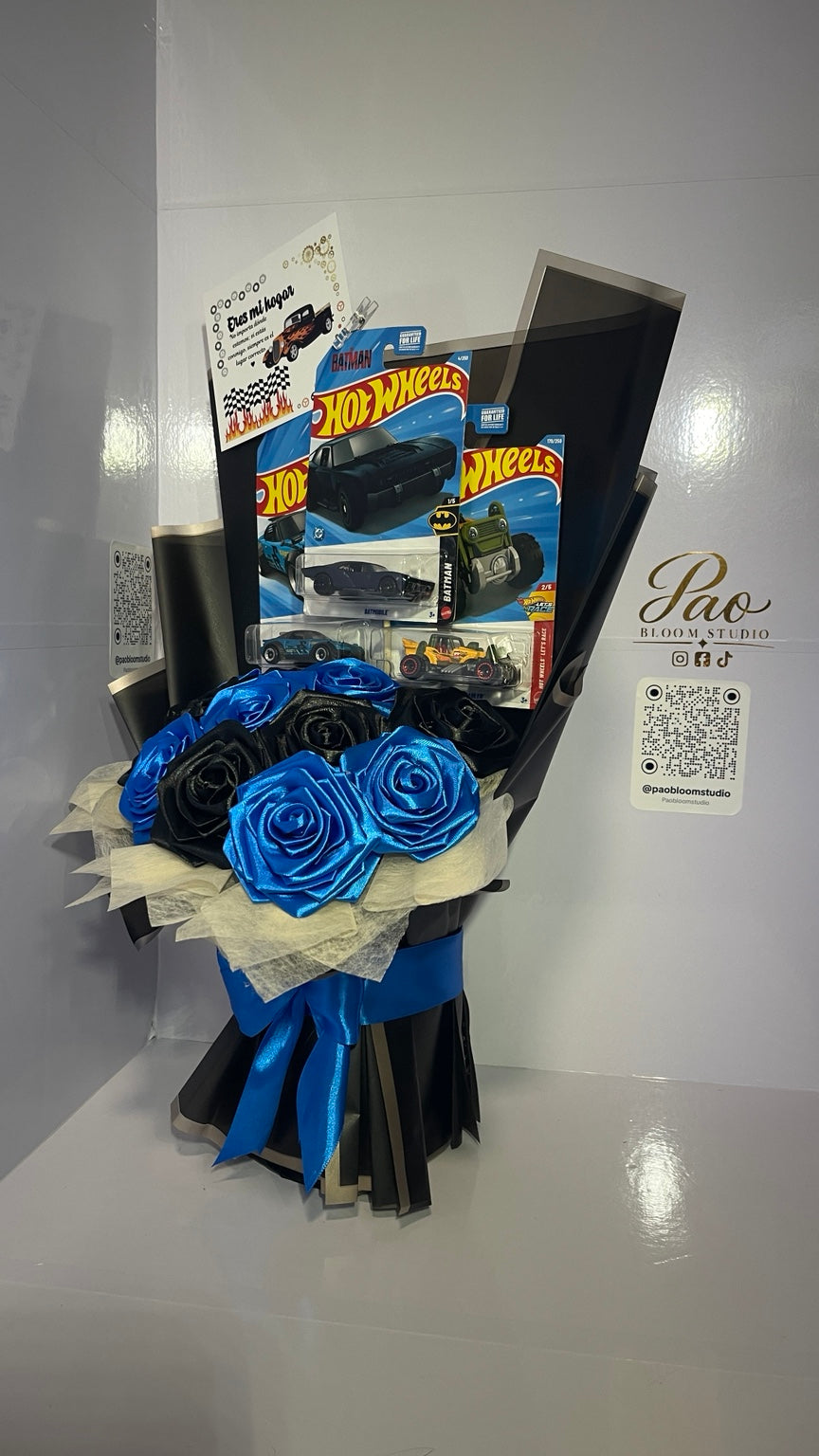 Detail of blue and black satin roses with toy cars