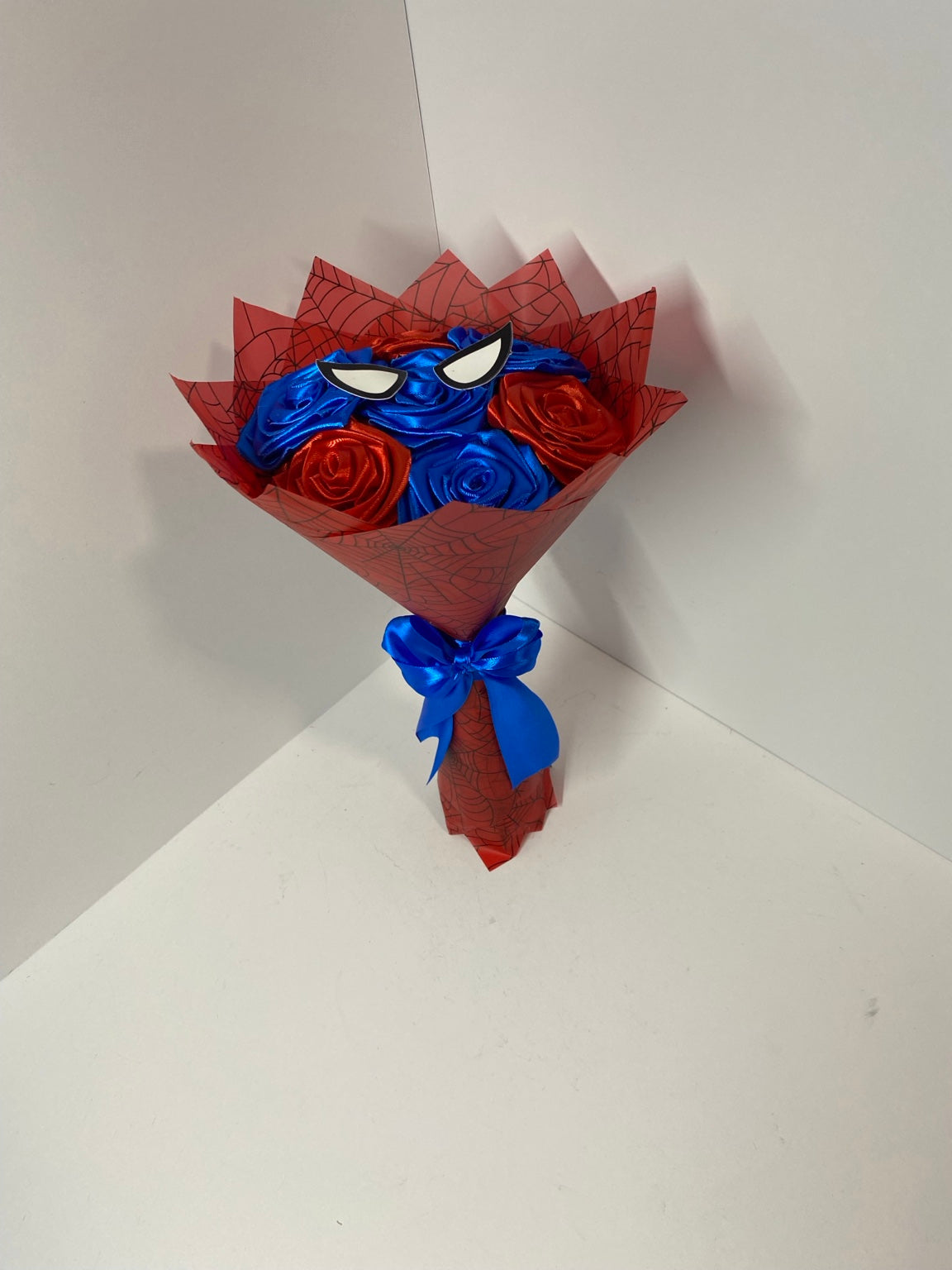 Front view of personalized red and blue satin rose bouquet