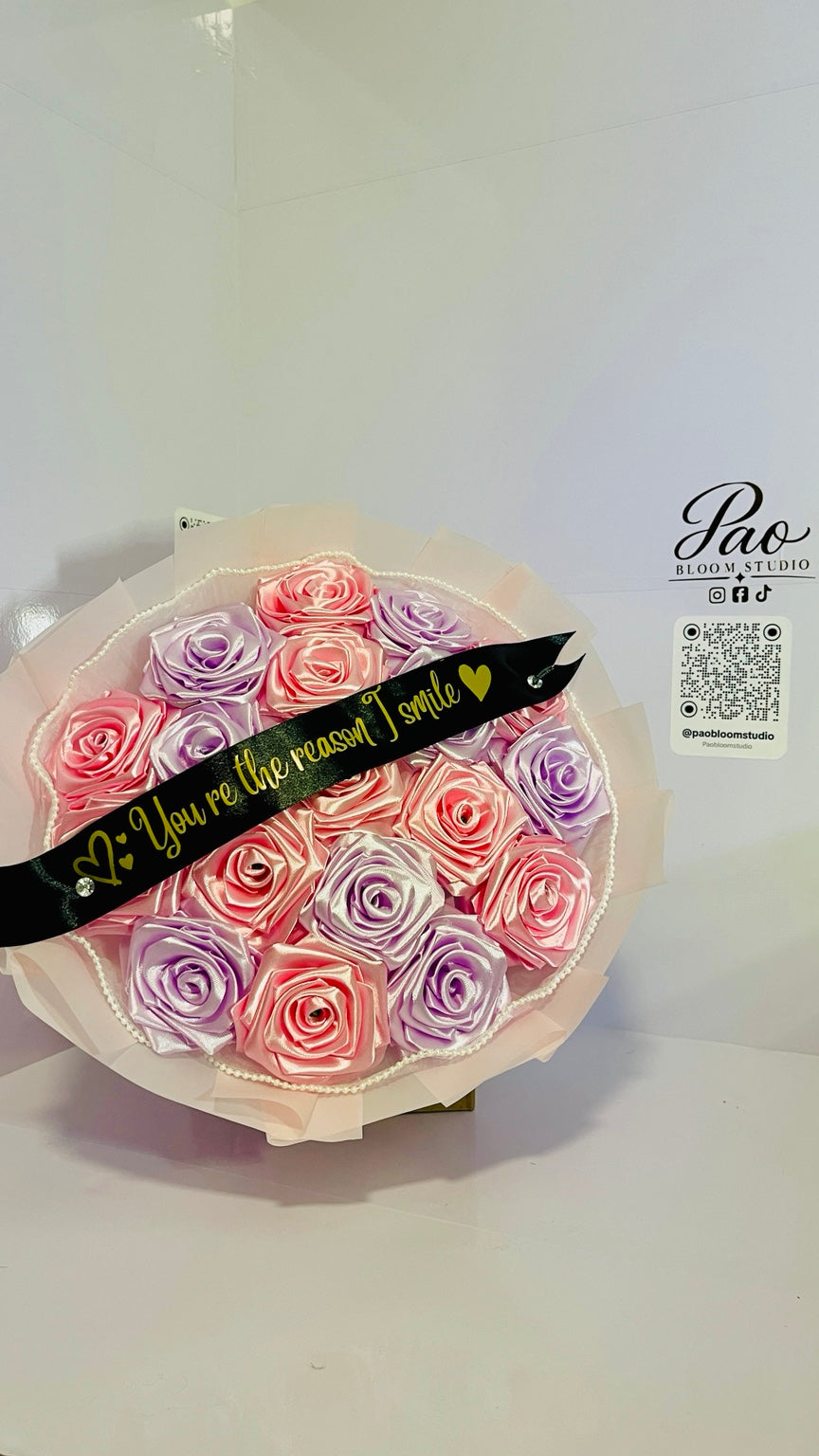 Front view of pink and lavender everlasting satin rose bouquet