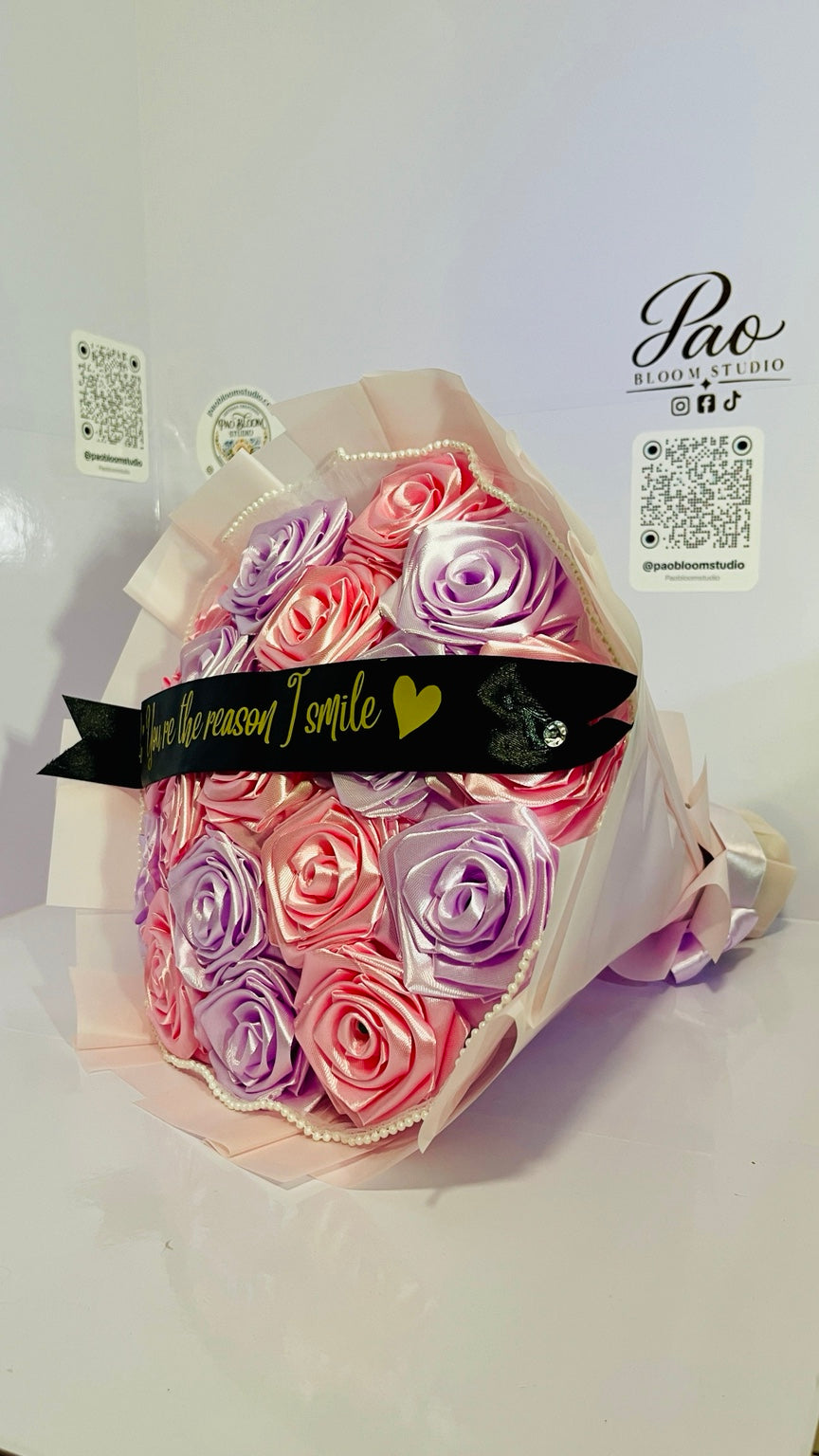 Side view of handcrafted pink and lavender satin rose bouquet