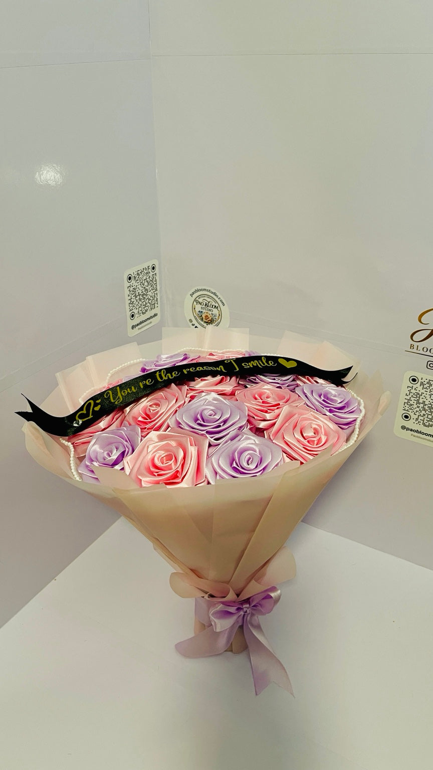 Top view of handcrafted satin ribbon roses in pink and lavender