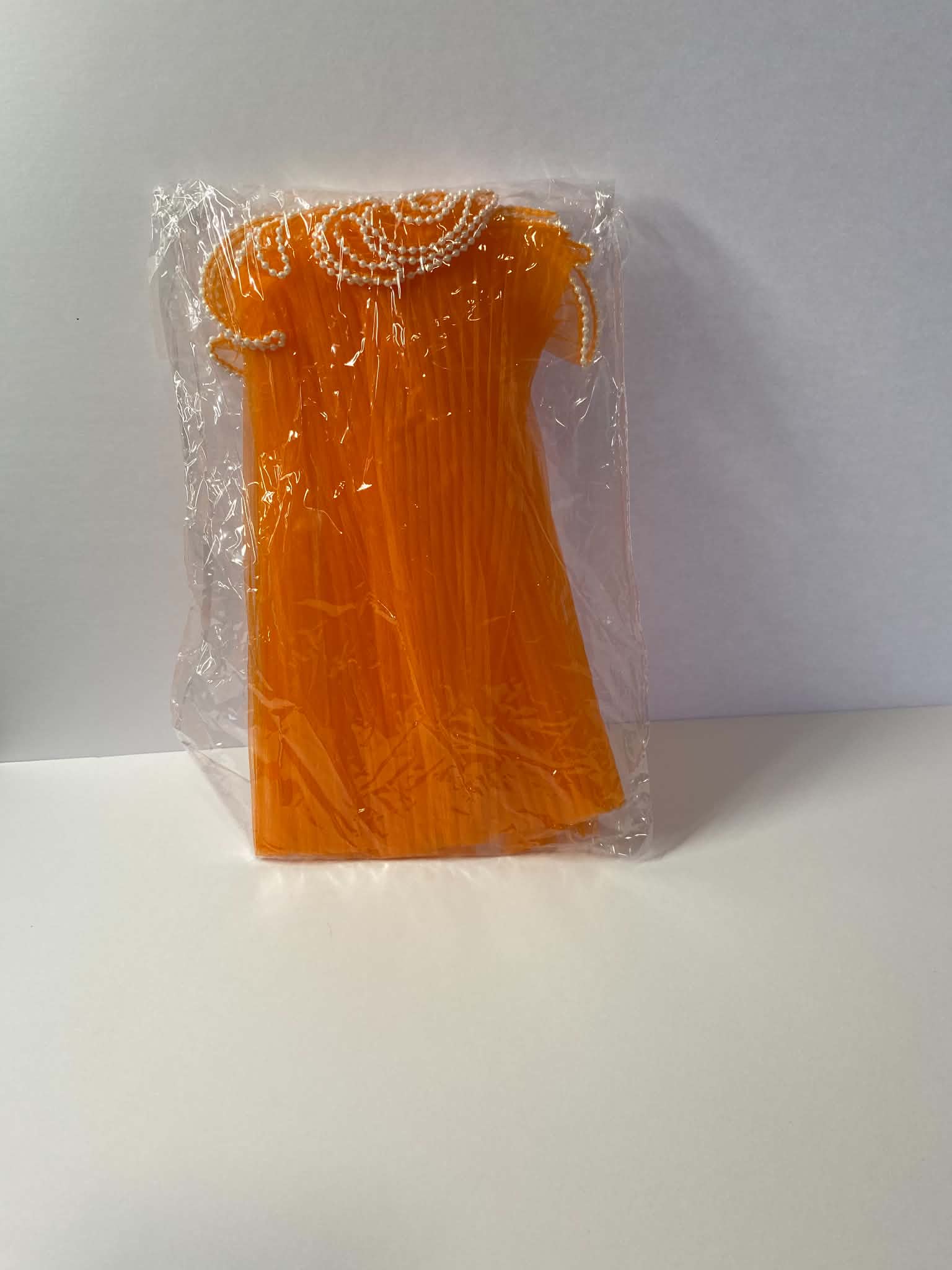Orange pleated organza bouquet wrap with pearl edge