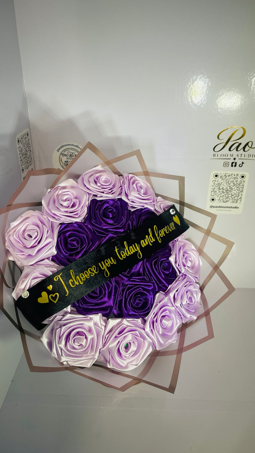 Angled view of purple and lavender satin rose bouquet