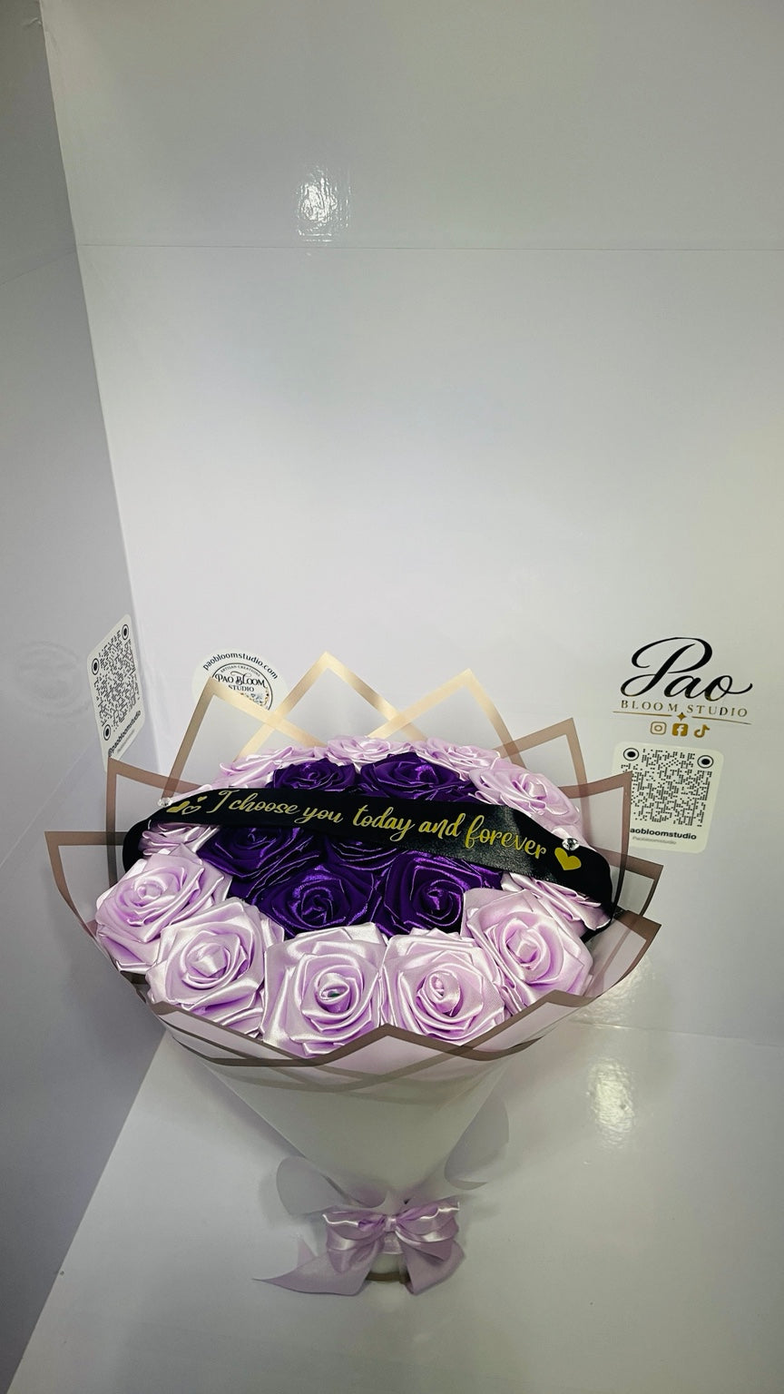 Display view of purple lavender satin ribbon rose bouquet