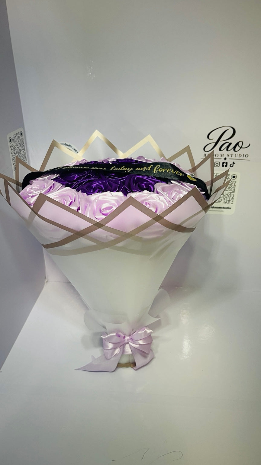 Full view of purple lavender everlasting rose bouquet with lavender bow