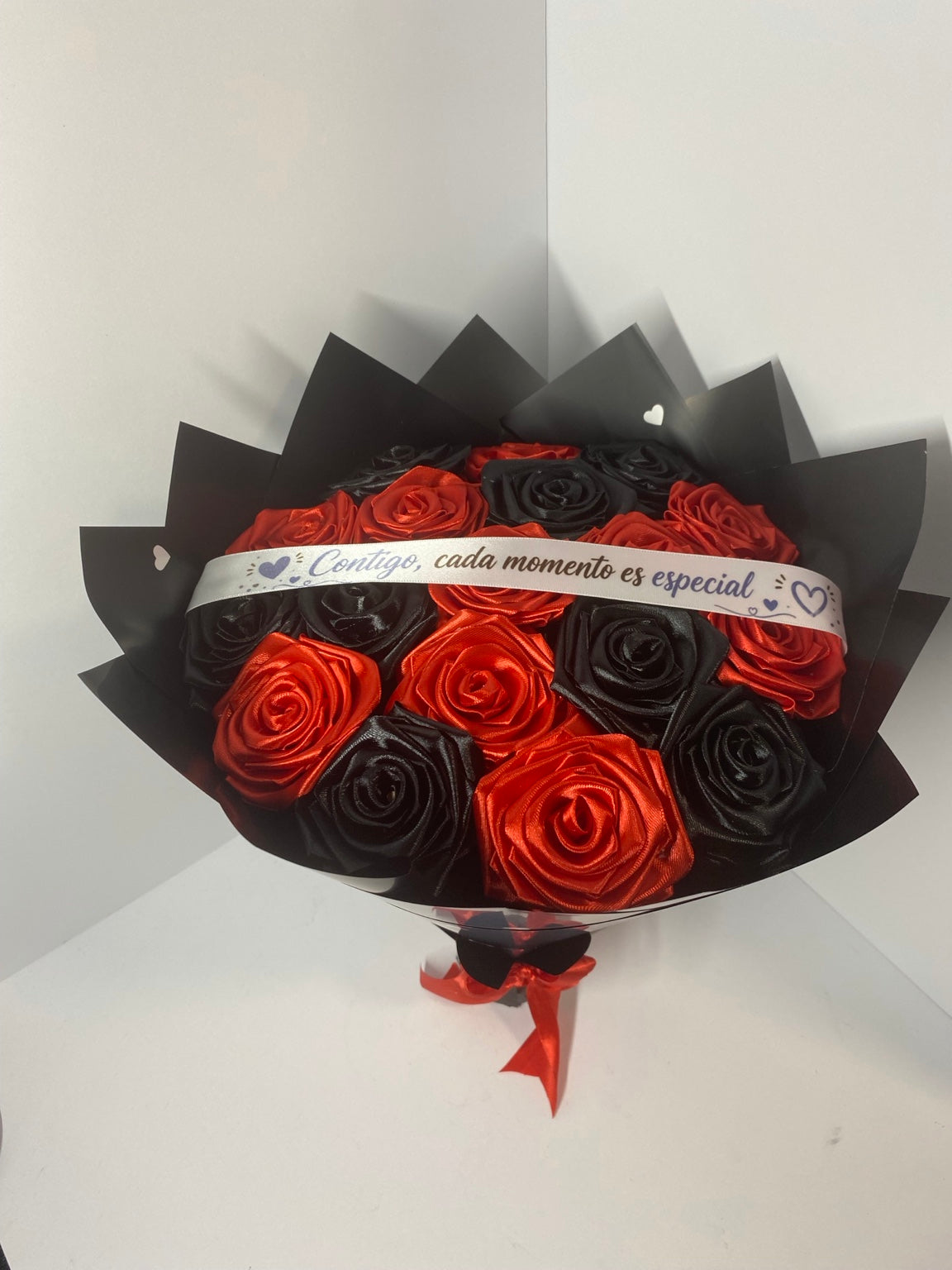 Red and black satin ribbon roses, close view