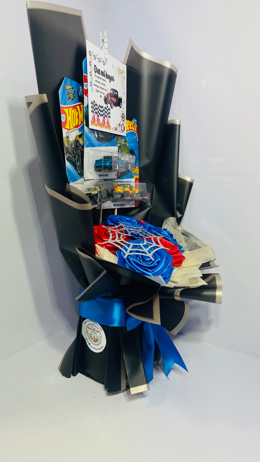 Left side view of toy car and satin rose bouquet